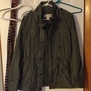 Rain coat can be worn casual over a top